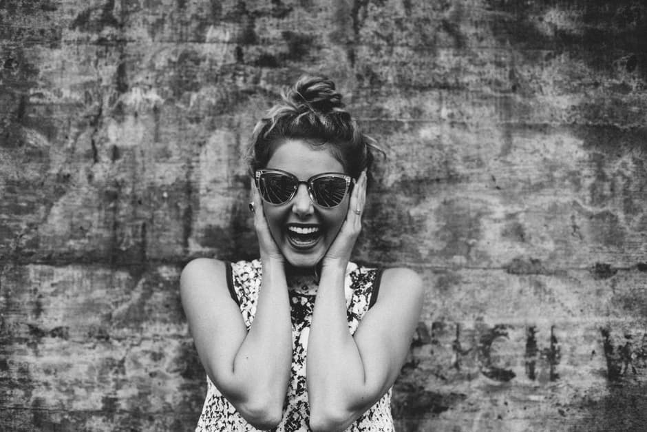 Black and white photo of a smiling woman