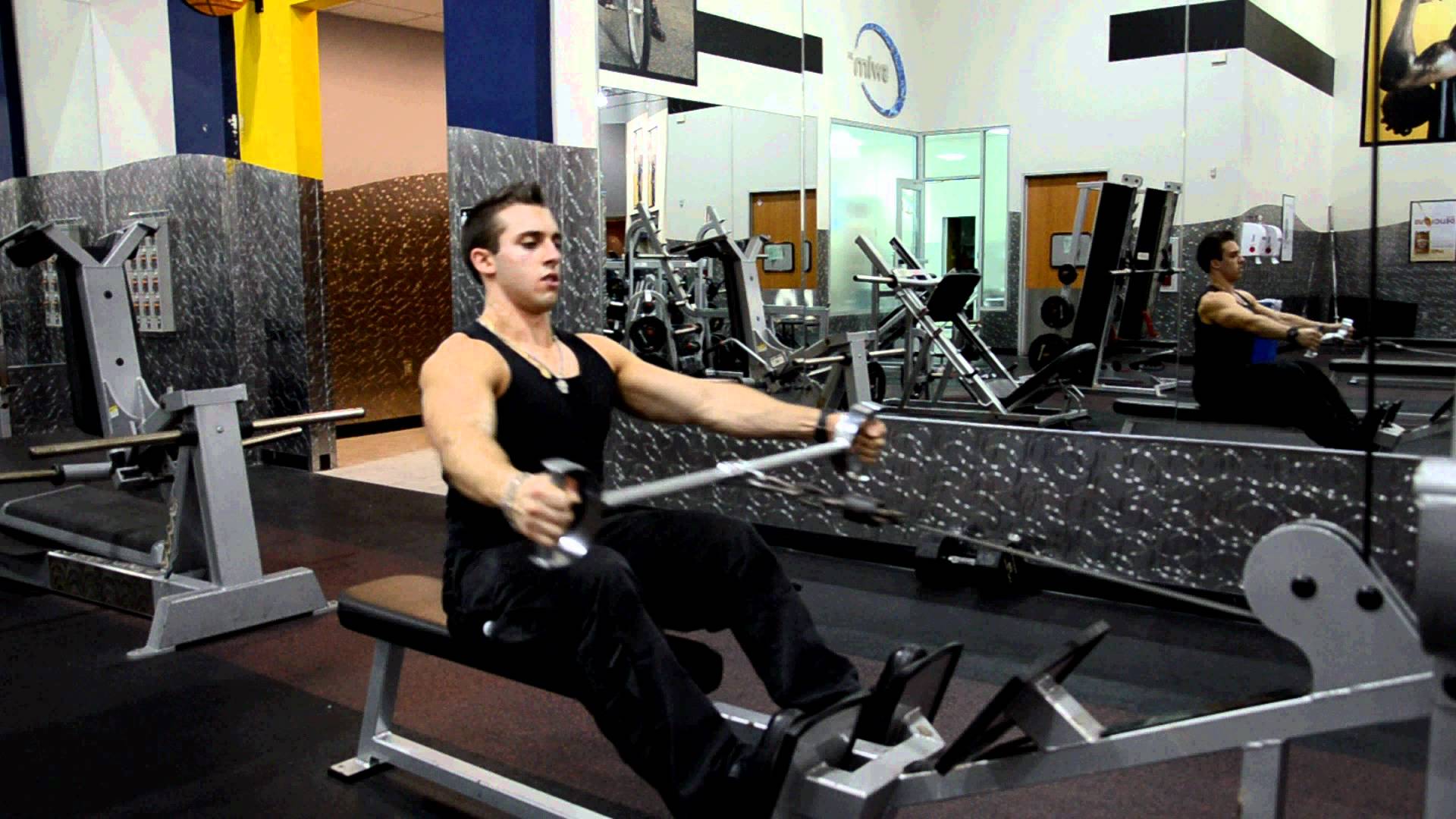 Man doing seated lat pulls