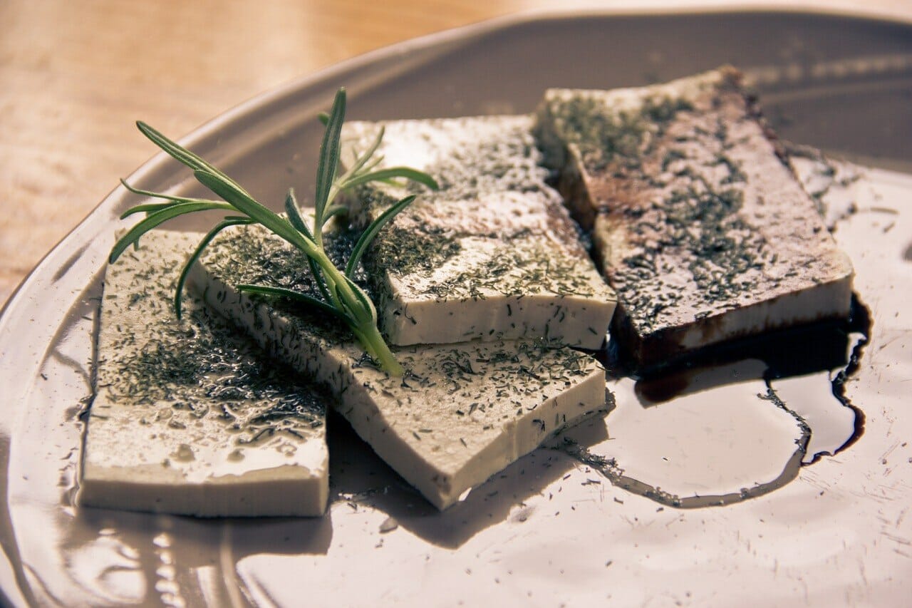 Tofu and olive oil dish on a plate