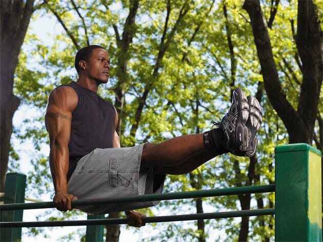 Man doing bodyweight exercises in a park