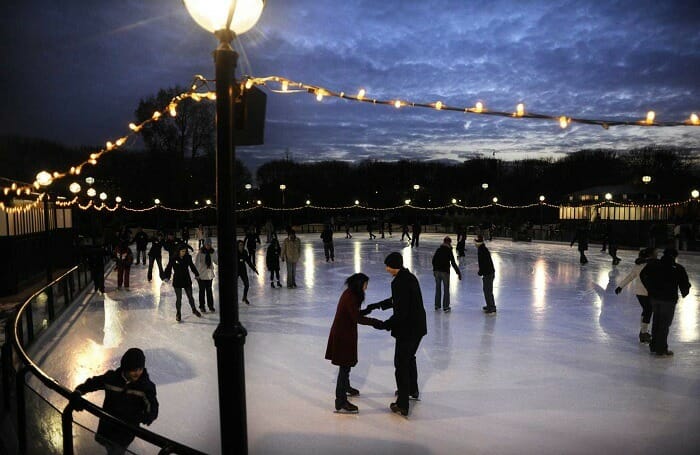 People skating in the park at night
