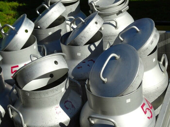 Couple of open milk cans