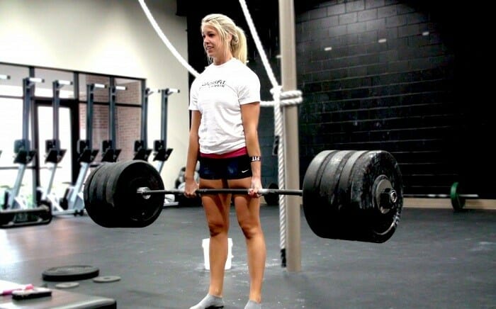 Woman lifting heavy weight