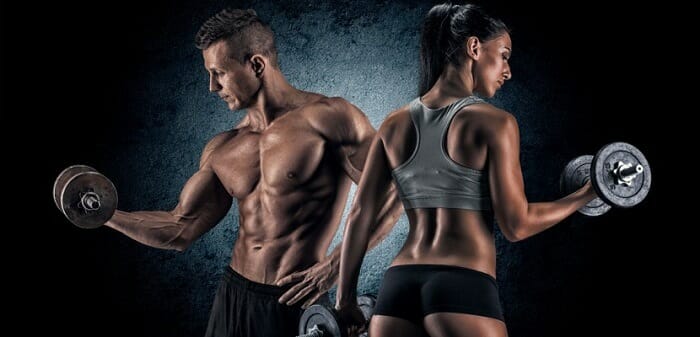 Attractive man and woman exercising at the gym