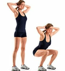 Woman showing how to perform squats