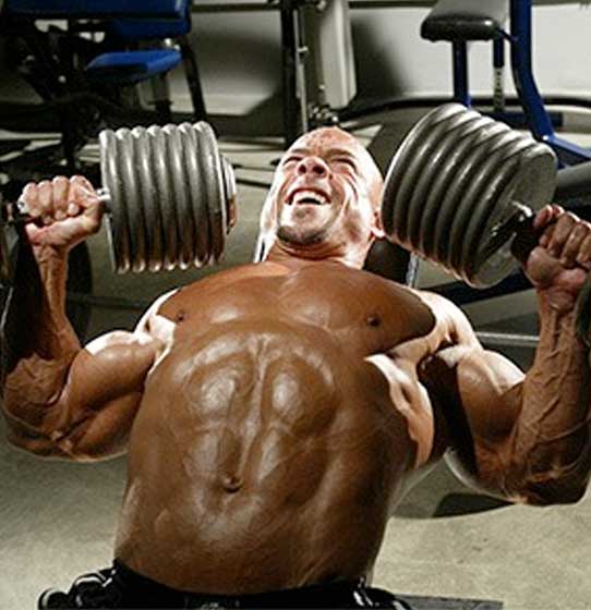 Man doing incline dumbbell chest workout