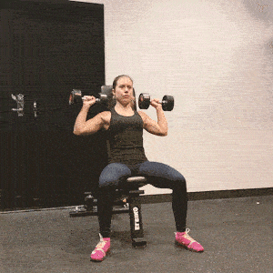 A woman doing shoulder press workouts