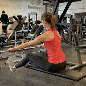 A person doing Seated Lat Bar Row