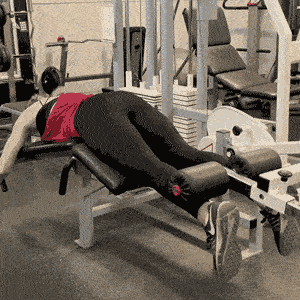 Woman doing lying leg curl