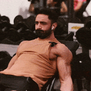 A person doing Incline Dumbbell Curls