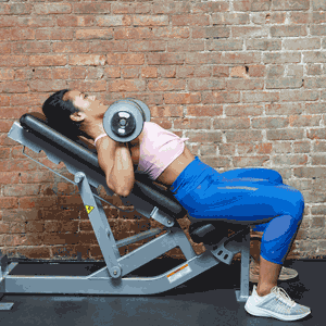 Woman doing an incline dumbbell bench press