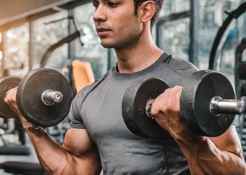 Man working out using dumbbells