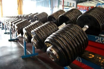 Black and white photo of dumbbells in a gym