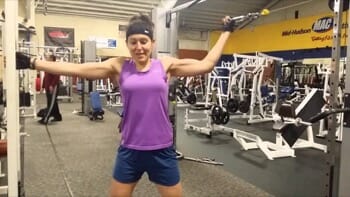 woman-using-cables-at-the-gym