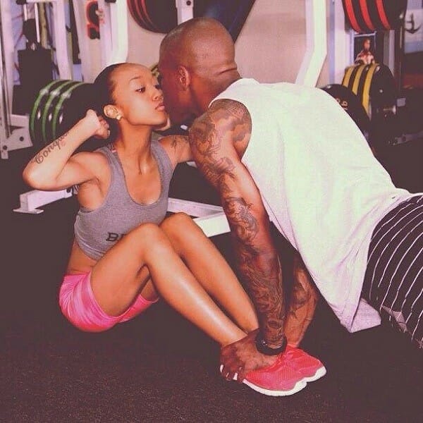 Couple kissing during workout