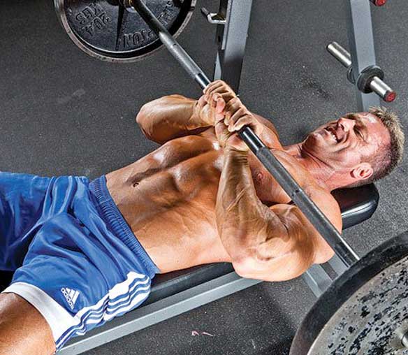 Man doing bench press workout in the gym