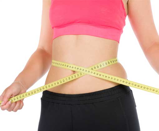 female. measuring her waist