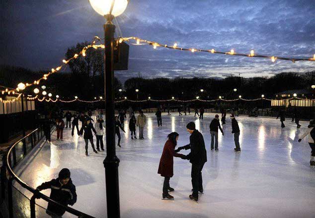 People skating in the park at night