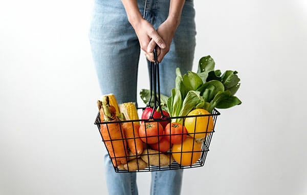 Woman-Carrying-Basket-of-Fruits-and-Vegetables