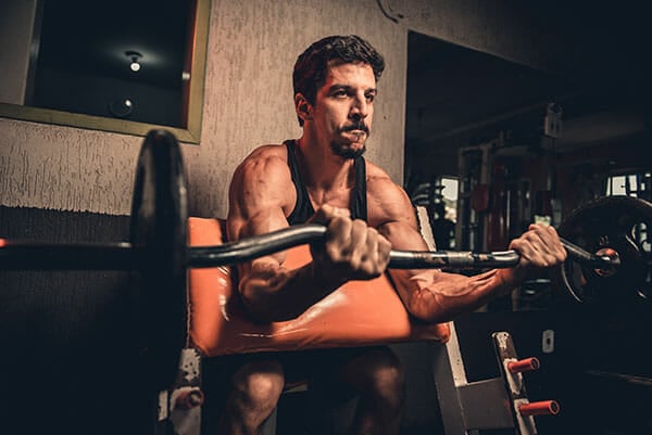 man bulking up in gym
