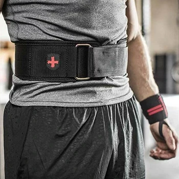 A close up shot of a man wearing a nylon weightlifting belt