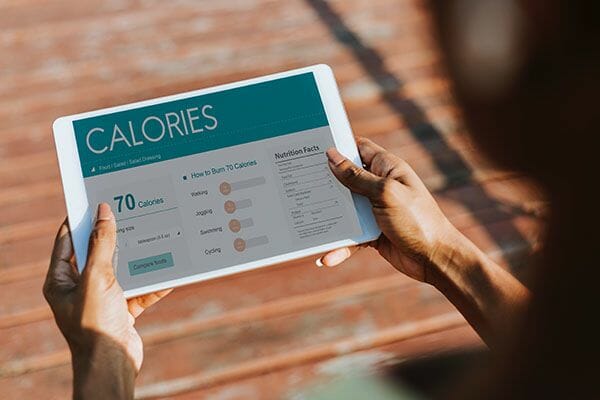 A person using a calorie counting app