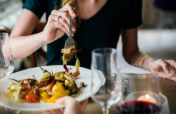 A woman eating at a restaurant