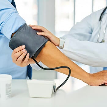 A doctor checking out High-Blood-Pressure from a patient