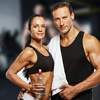 A man and a woman doing the P90X program