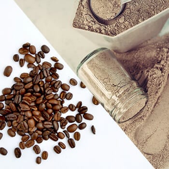Close up shot of coffee beans on a table and protein powder beside the coffee beans