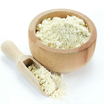 Close up shot of protein powder on a wooden bowl and spoon