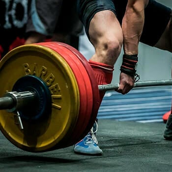 man using barbell