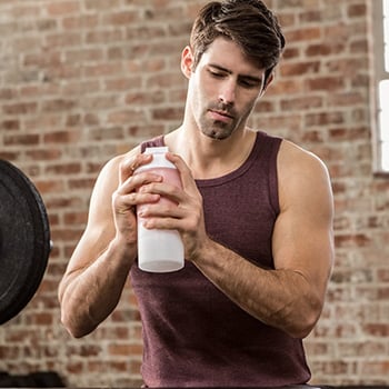 man shaking his bottle