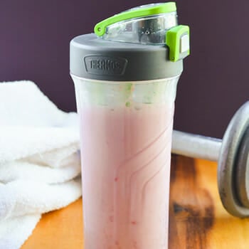 Close up shot of pink protein powder on a table