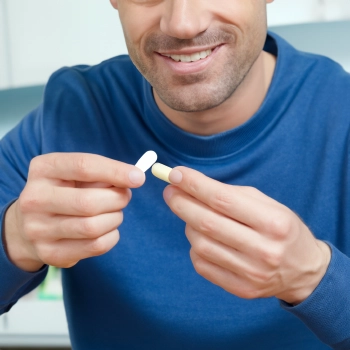 A man taking a supplement