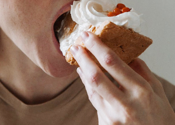 man eating cake