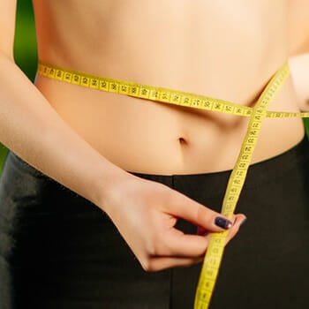 Woman losing belly fat