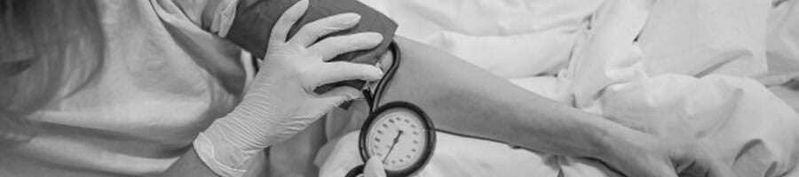 woman getting his blood pressure checked