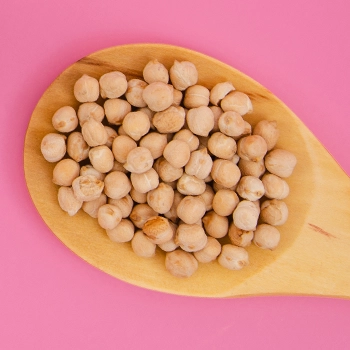 Soy beans on a wooden spoon