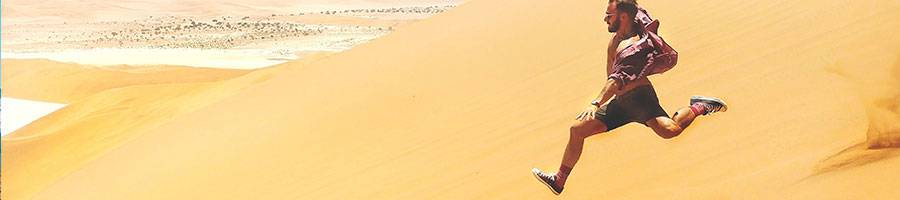 man running down on desert