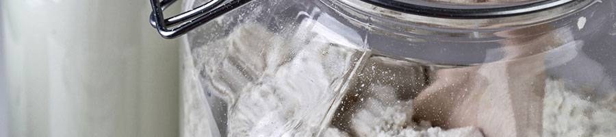 powder in glass jar with wooden spoon