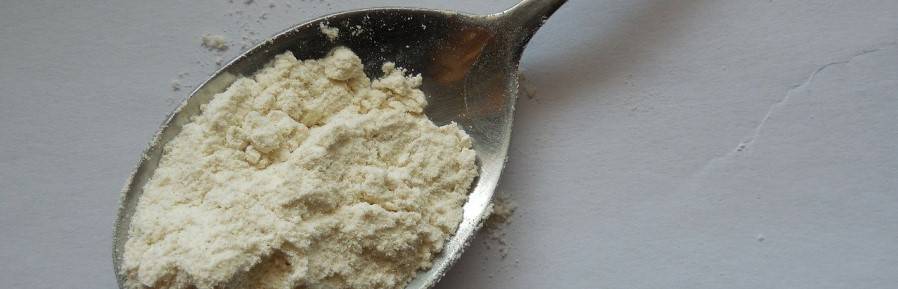 Creatine powder on a spoon