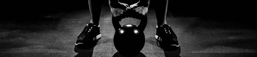 man using kettlebell