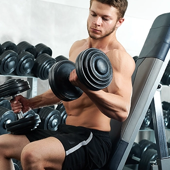 Lifting dumbbell on an inclined bench