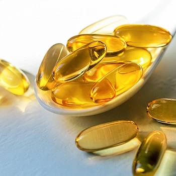 Fish oil supplements on a spoon