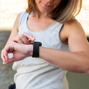 woman checking her fitness tracker