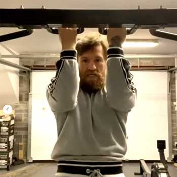 Conor Mcgregor doing pullups at the gym