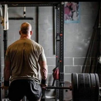 man lifting weights