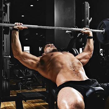 A man working out his chest by doing incline bench press