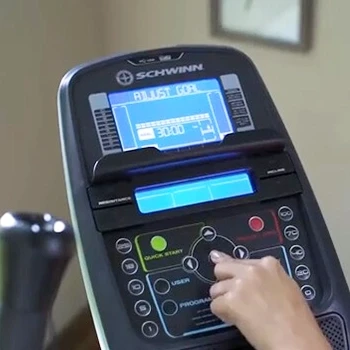 A person using Schwinn 470 Elliptical with versatile built-in fitness programs